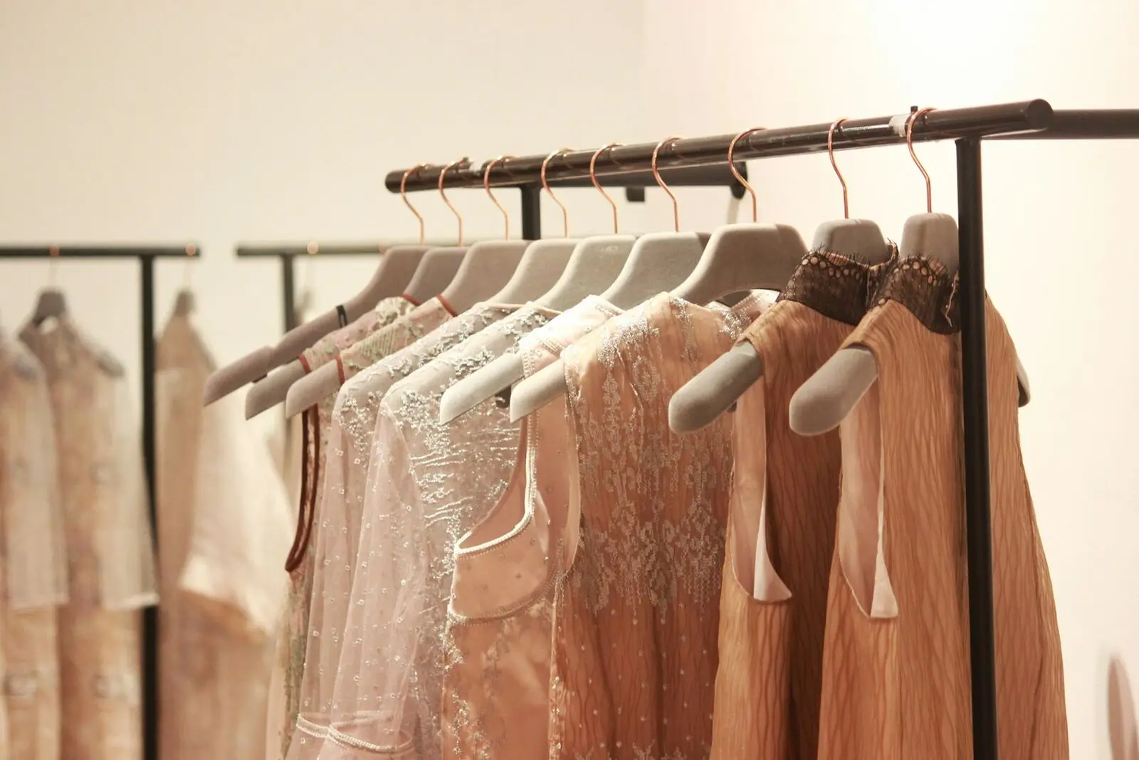 Tops hanging on a boutique rack
